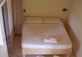 Slaapkamer in het vakantiehuis Marche