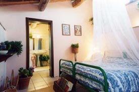 Slaapkamer in het vakantiehuis Marche