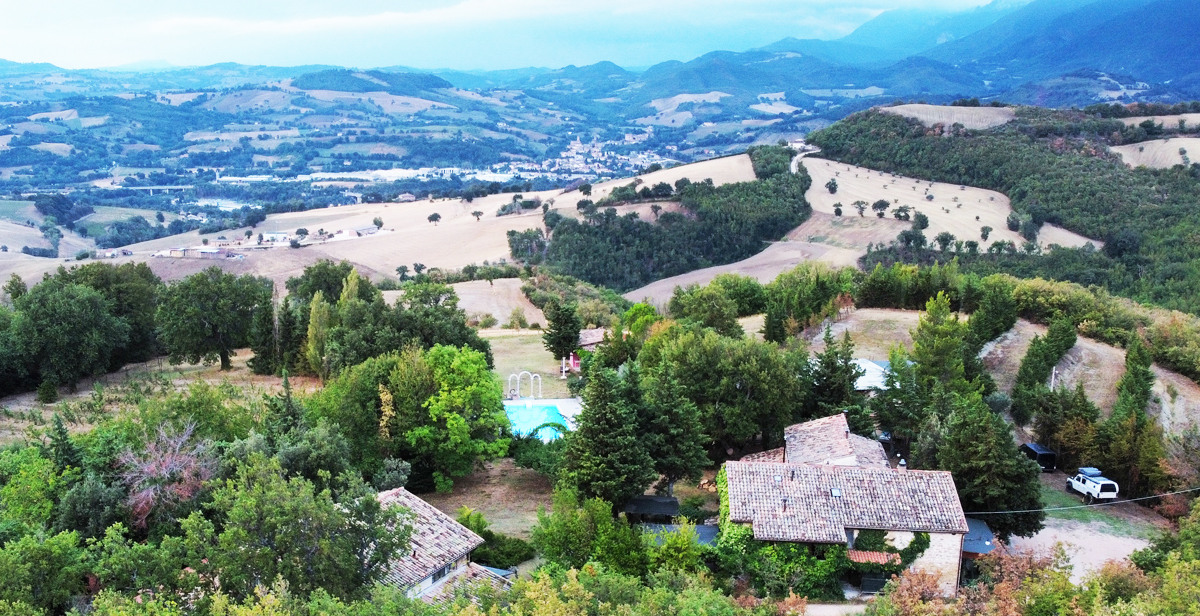 view of the property with pool in Marche