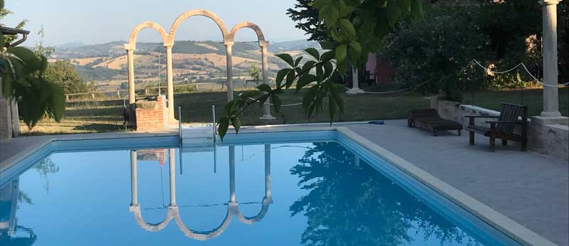 the Property has a beautiful pool and gardens, in Marche Italy