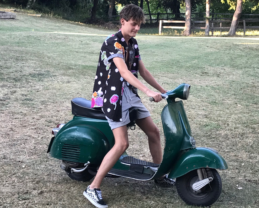 rockabilly riding Vespa